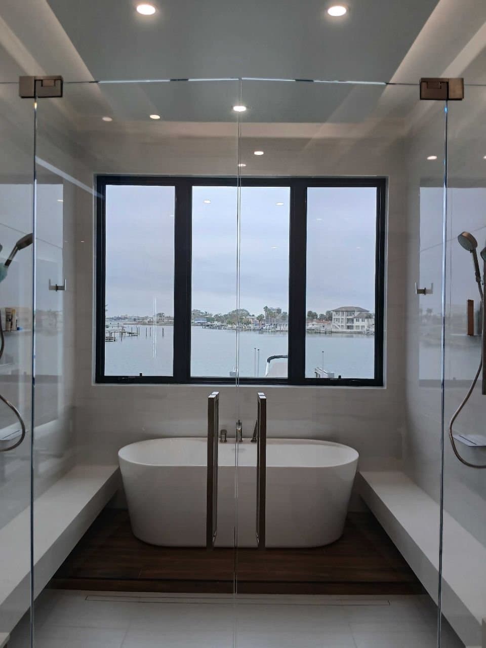 Bathroom with freestanding tub and water view after a deep clean