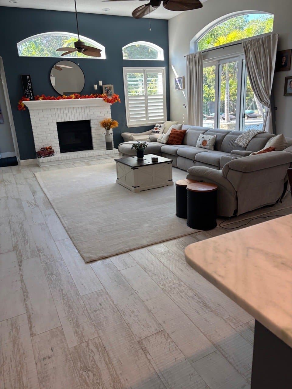 Open living room with fireplace after a standard clean
